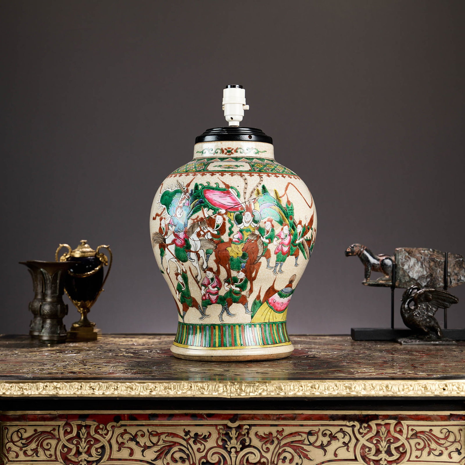 A LARGE CHINESE QING DYNASTY CRACKLE GLAZE PORCELAIN VASE LAMP: A LARGE CHINESE QING DYNASTY CRACKLE GLAZE PORCELAIN VASE LAMP the crackleware vase decorated with warriors on horses, with four character mark to underside, later adapted as a table lamp base, 36cm h