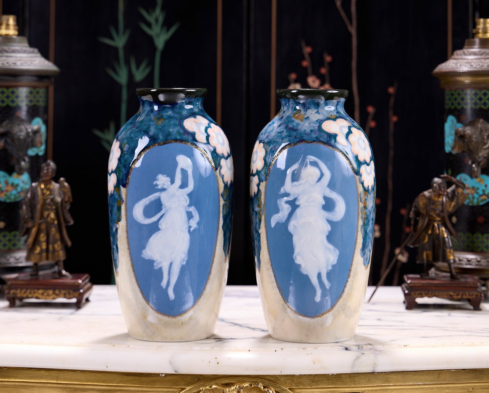 A PAIR OF LIMOGES PATE SUR PATE STYLE PORCELAIN VASES BY C. THARAUD C. 1930: A PAIR OF LIMOGES PATE SUR PATE STYLE PORCELAIN VASES BY C. THARAUD C. 1930 of baluster form, each with a panel depicting a dancing classical maiden in the pate sur pate style, flanked by stylised flo