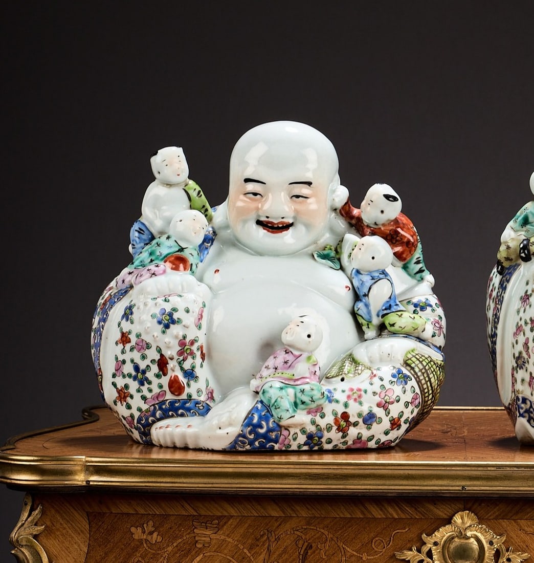 A CHINESE FAMILLE ROSE PORCELAIN FIGURE OF THE LAUGHING BUDDHA: A CHINESE FAMILLE ROSE PORCELAIN FIGURE OF THE LAUGHING BUDDHA surrounded by children, marked to underside, 23cm high