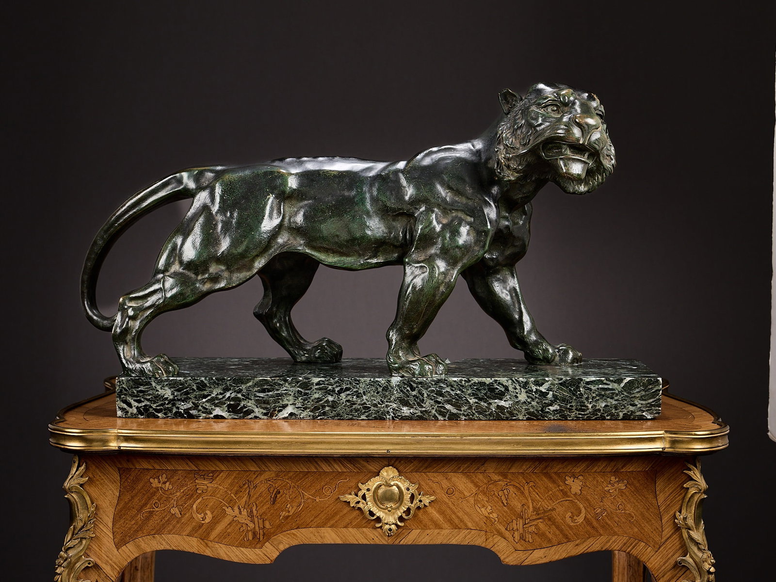 A LARGE EARLY 20TH CENTURY FRENCH BRONZE MODEL OF A WALKING TIGER: A LARGE EARLY 20TH CENTURY FRENCH BRONZE MODEL OF A WALKING TIGER dark brown patination, on a verde antico marble plinth, (crack to plinth) 58cm x 33cm