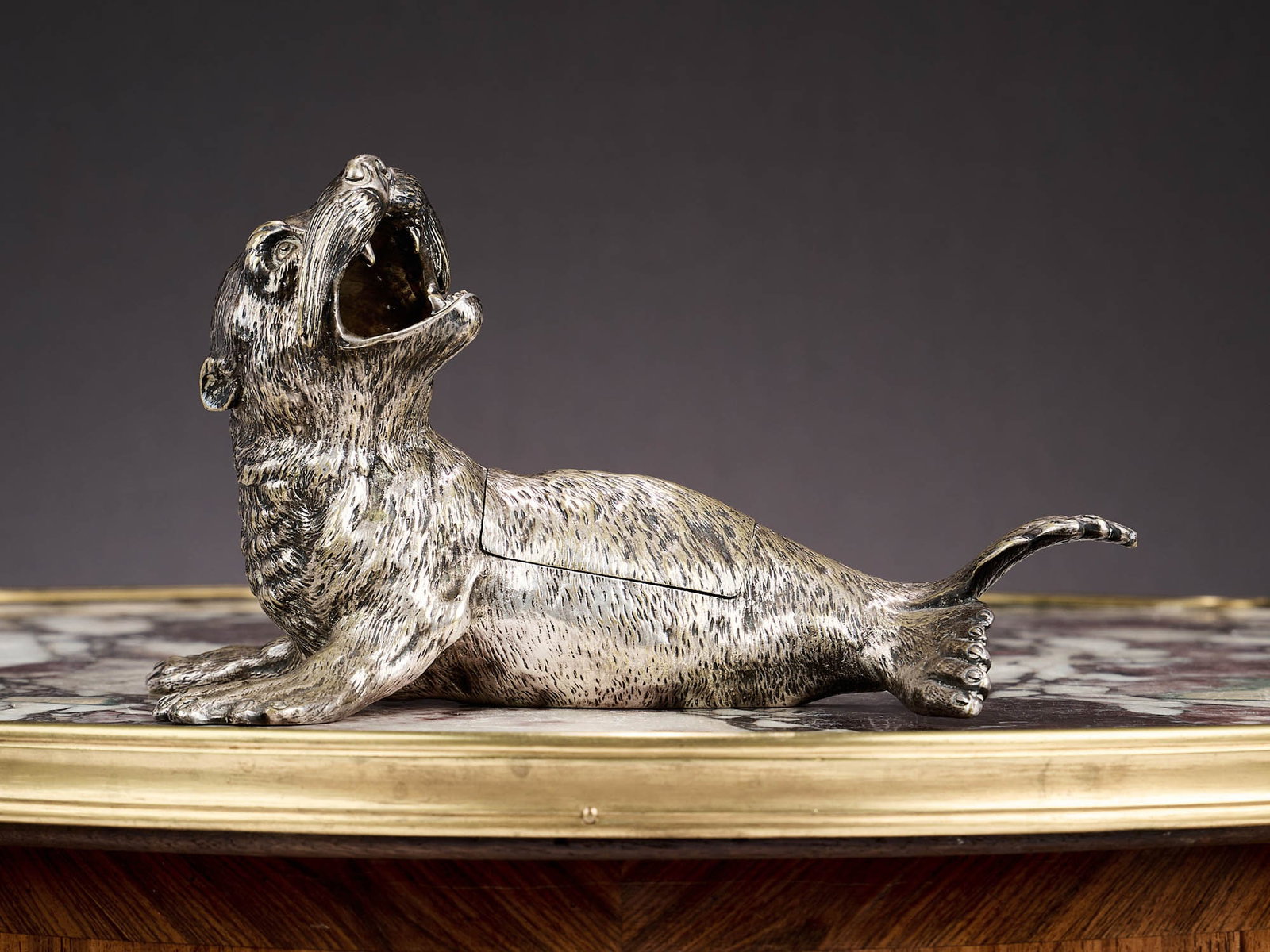 AUGUSTE KLEIN, PARIS: A RARE SILVERED BRONZE NOVELTY DESK TIDY C. 1860: AUGUSTE KLEIN, PARIS: A RARE SILVERED BRONZE NOVELTY DESK TIDY C. 1860 the 19th century French silver bronze model of a sea lion with wide open mouth, the body with hinged section opening to reveal a 