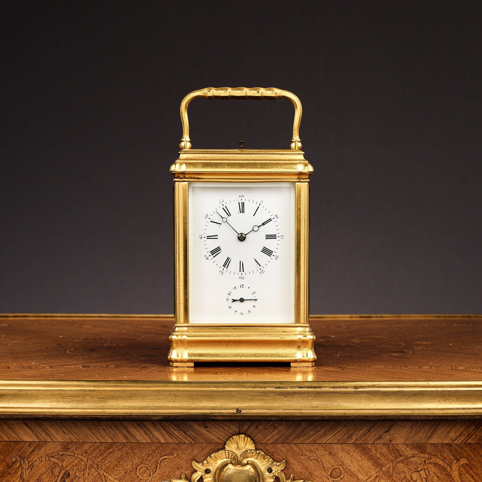 A 19TH CENTURY FRENCH GILT BRASS GRANDE SONNERIE STRIKING CARRIAGE CLOCK WITH ALARM: A 19TH CENTURY FRENCH GILT BRASS GRANDE SONNERIE STRIKING CARRIAGE CLOCK WITH ALARM the ornate gorge type case with glazed pin-hinged door, on ogee moulded skirt base, with push repeat handle over, th