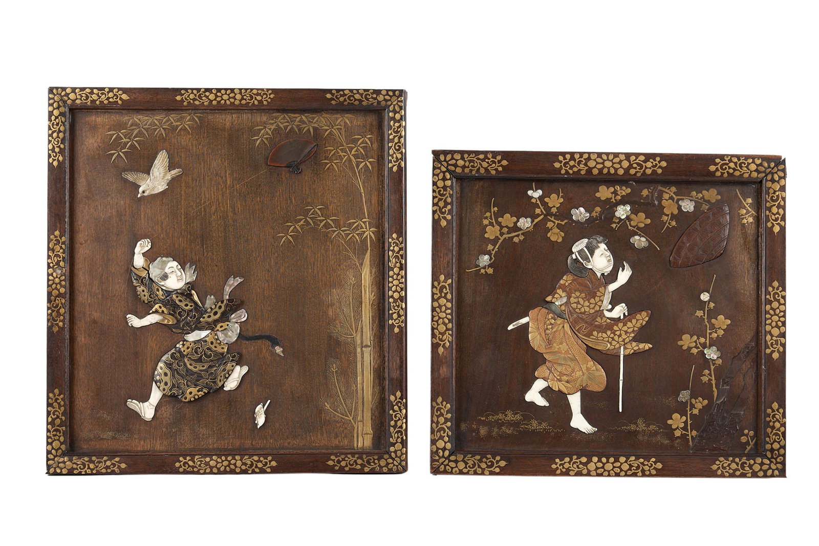 TWO JAPANESE MEIJI PERIOD GOLD LACQUER AND SHIBAYAMA STYLE INLAID WOOD PANELS: TWO JAPANESE MEIJI PERIOD GOLD LACQUER AND SHIBAYAMA STYLE INLAID WOOD PANELS probably originally forming part of a cabinet, late 19th / early 20th century, one depicting a young lady flying a kite, a