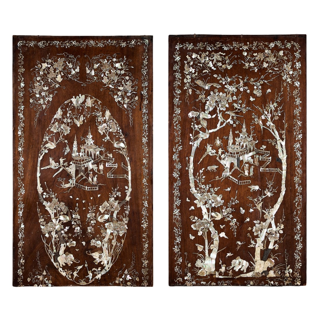 A PAIR OF LATE 19TH CENTURY INLAID MOTHER OF PEARL PANELS, VIETNAM: A PAIR OF LATE 19TH CENTURY INLAID MOTHER OF PEARL PANELS, VIETNAM the 'Royal Vietnam' panels richly inlaid with stained mother of pearl in a hardwood ground, depicting pagodas and figures flanked by 