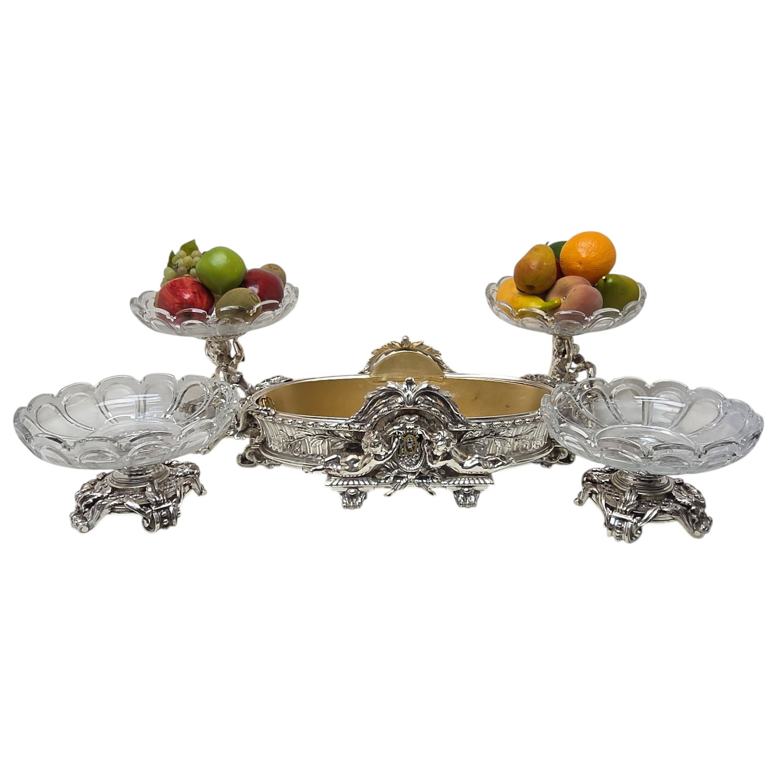 A 19TH CENTURY FRENCH SILVER JARDINEIRE SUITE: A 19TH CENTURY FRENCH SILVER JARDINEIRE SUITE the set of comports / jardinieres comprising a large jardiniere with twin acanthus wrapped handles and mounted with putti, a pair of glass bowls raised on