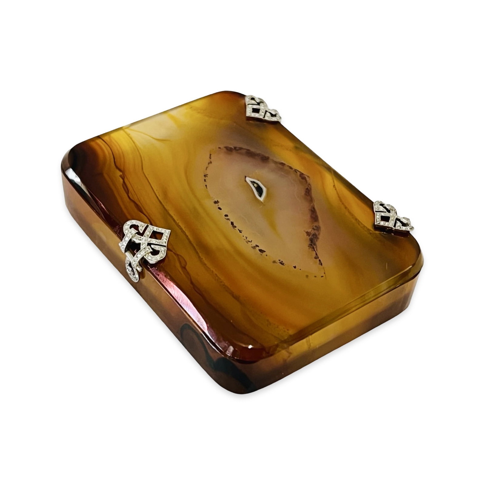 AN ART DECO AGATE AND DIAMOND SET BOX: AN ART DECO AGATE AND DIAMOND SET BOX probably 1920's, French, the hinge and clasp of scrolling design and set with diamonds, 8cm x 6cm