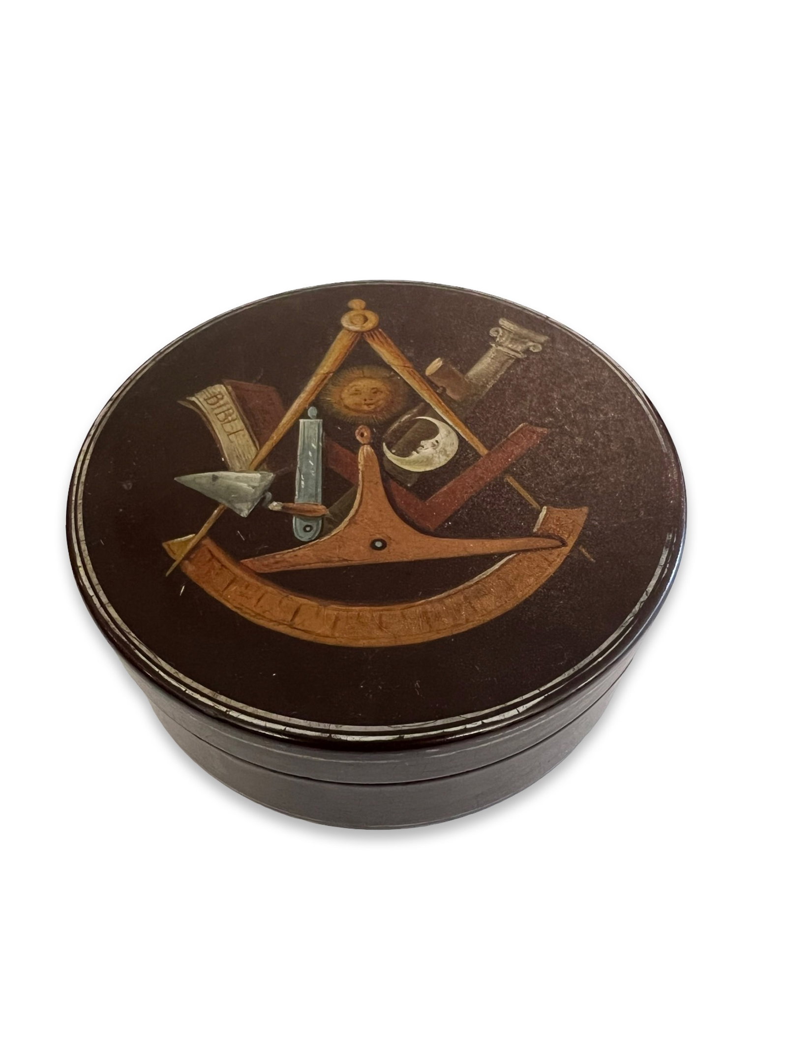 AN EARLY 19TH CENTURY BOX PAINTED WITH MASONIC SYMBOLS: AN EARLY 19TH CENTURY BOX PAINTED WITH MASONIC SYMBOLS English, the circular lacquered and painted snuff box with removable cover painted with various Masonic symbols including the sun, moon and a bib
