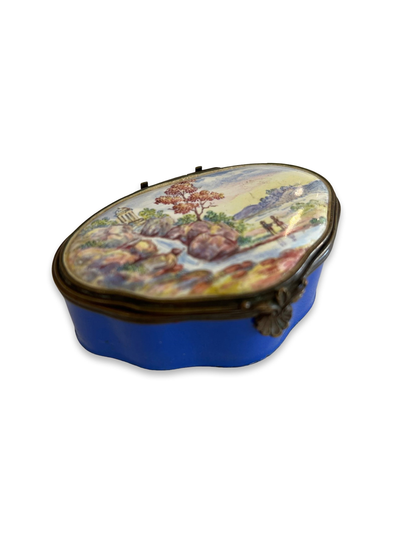 AN 18TH CENTURY BILTSON ENAMEL BOX WITH LANDSCAPE: AN 18TH CENTURY BILTSON ENAMEL BOX WITH LANDSCAPE George III period, South Staffordshire, of shaped oval form, the hinged cover with arcadian landscape, the sides dark blue, the interior white, with s