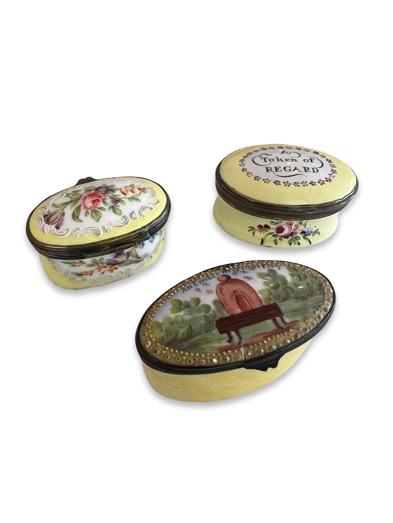 AN 18TH CENTURY BILSTON ENAMEL BOX 'A TOKEN OF REGARD', WITH TWO OTHER BOXES: AN 18TH CENTURY BILSTON ENAMEL BOX 'A TOKEN OF REGARD', WITH TWO OTHER BOXES George III period, South Staffordshire, the oval patch box with motto to top and mirror to the inside, together with two 19