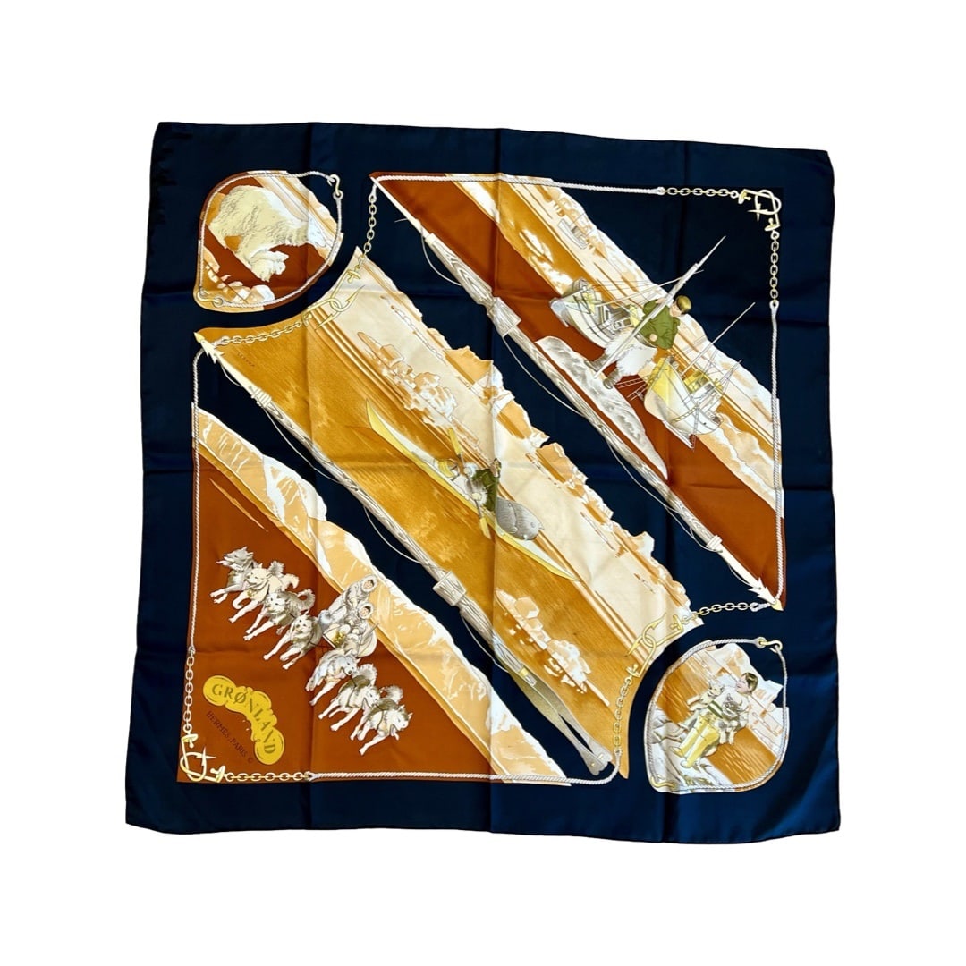 HERMES: A CARRE 90 SILK SCARF, 'GRONLAND': HERMES: A CARRE 90 SILK SCARF, 'GRONLAND' the scarf decorated with eskimo figures and husky dogs in pale browns and black, marked 'HERMES PARIS', 90cm