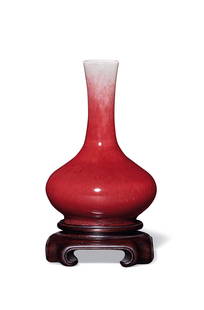 A RED-GLAZED VASE Period of Qianlong, Qing Dynasty: 10.6 cm Height