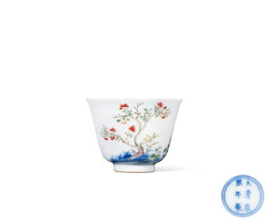 AN INSCRIPT BLUE AND WHITE WUCAI 'POMEGRANATE FLOWER' CUP Mark and Period of Kangxi, Qing Dynasty: 6.6 cm Diam.