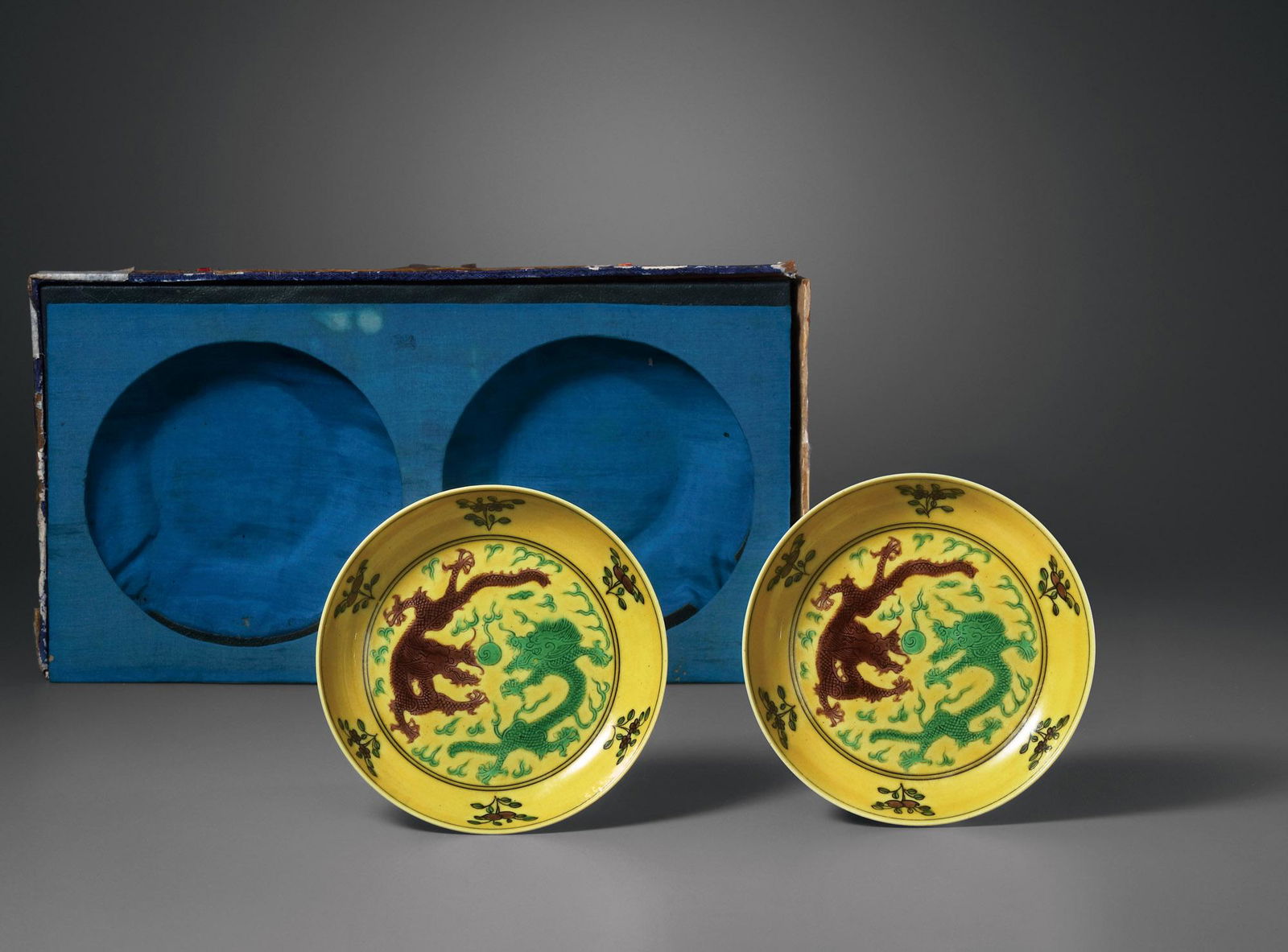 A PAIR OF YELLOW-GROUND SANCAI-ENAMEL 'DRAGON' DISHES Mark and Period of Guangxu, Qing Dynasty (1 of 2)