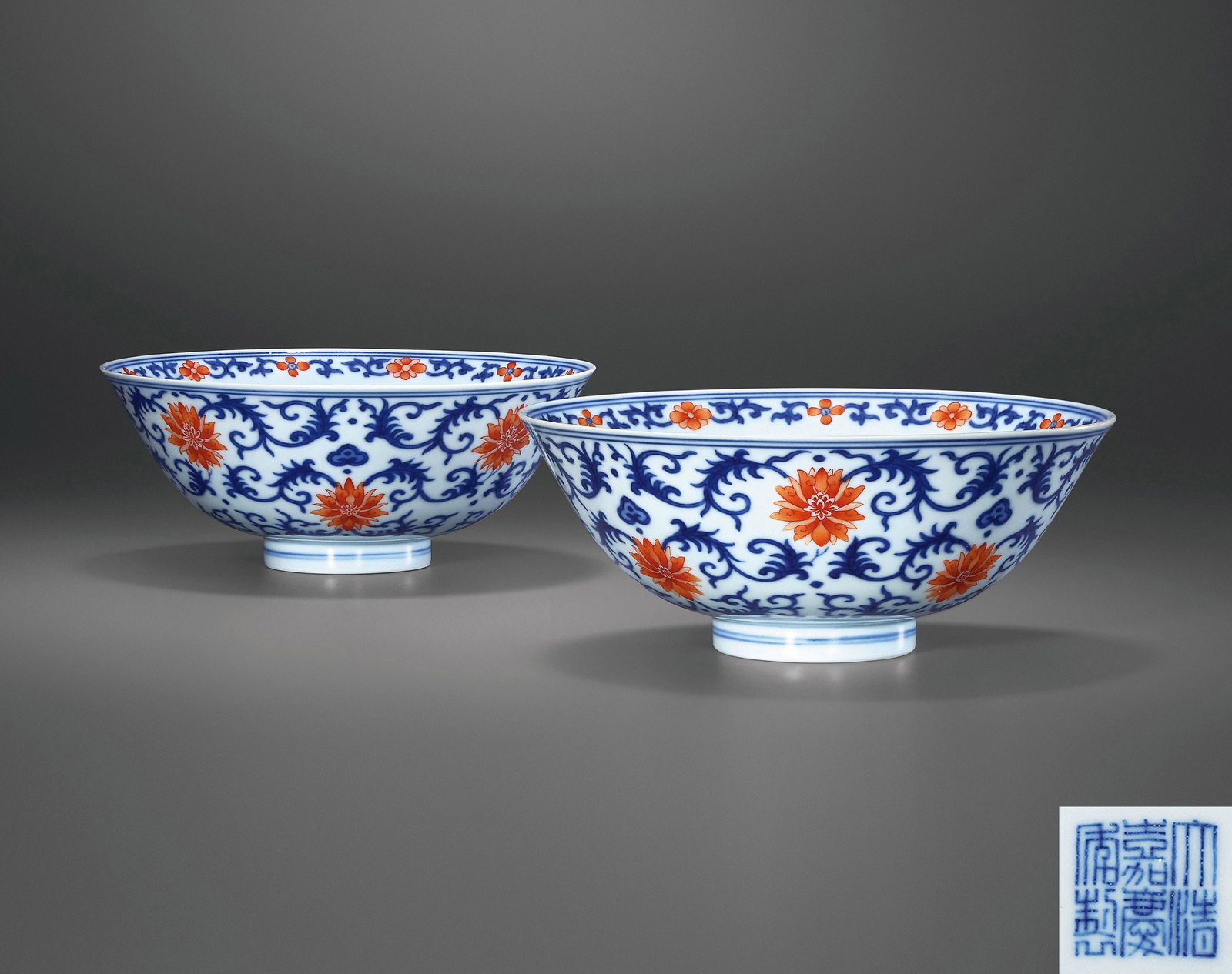 A PAIR OF BLUE AND WHITE IRON-RED 'INTERLOCKING LOTUS' BOWLS Seal Mark and Period of Jiaqing, Qing (1 of 3)