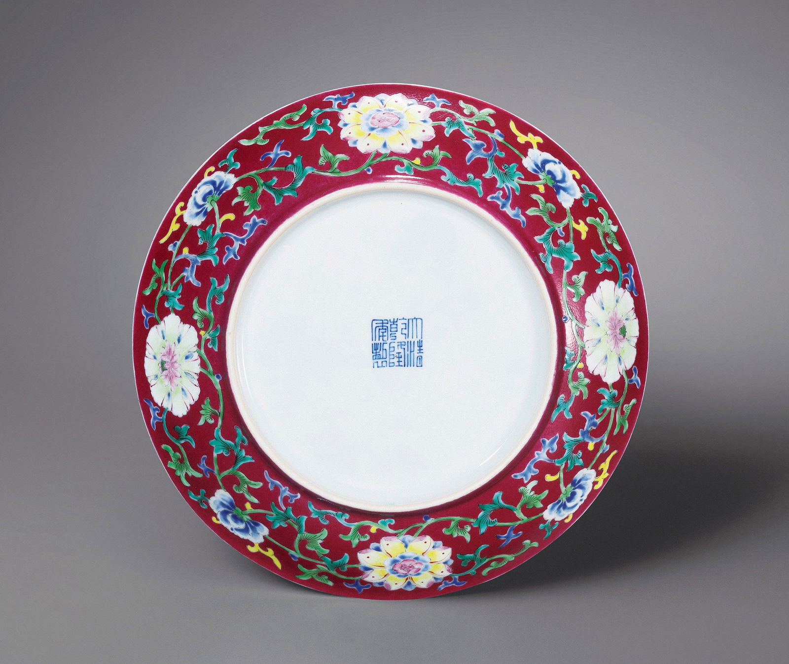 A IRON-RED AND FAMILLE-ROSE 'BAT AND SHOU' 'FLOWERS' DISH Seal Mark and Period of Qianlong, Qing (1 of 2)