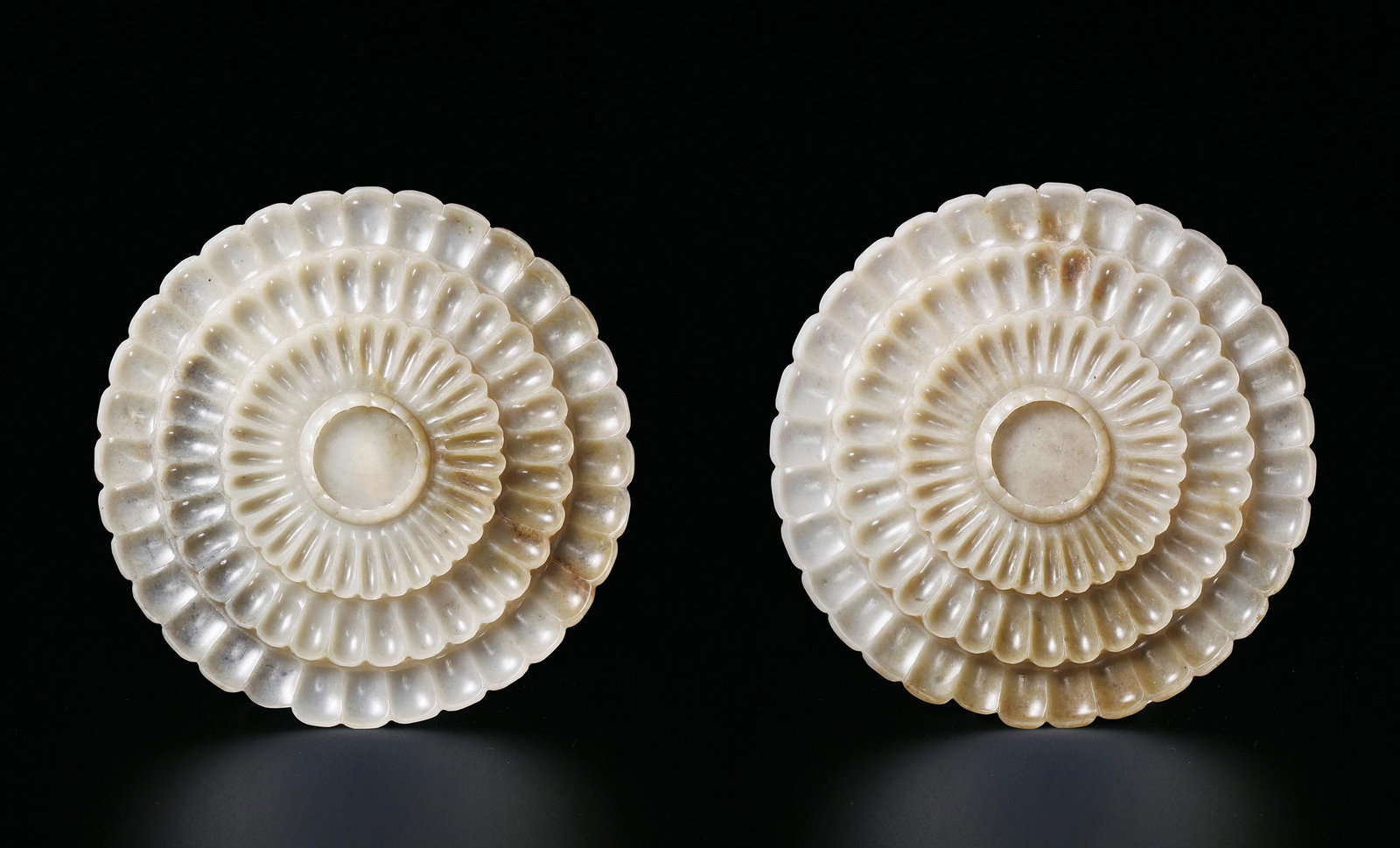 A PAIR OF CELADON JADE FLOWER-SHAPED DISHES Ming Dynasty (1 of 1)