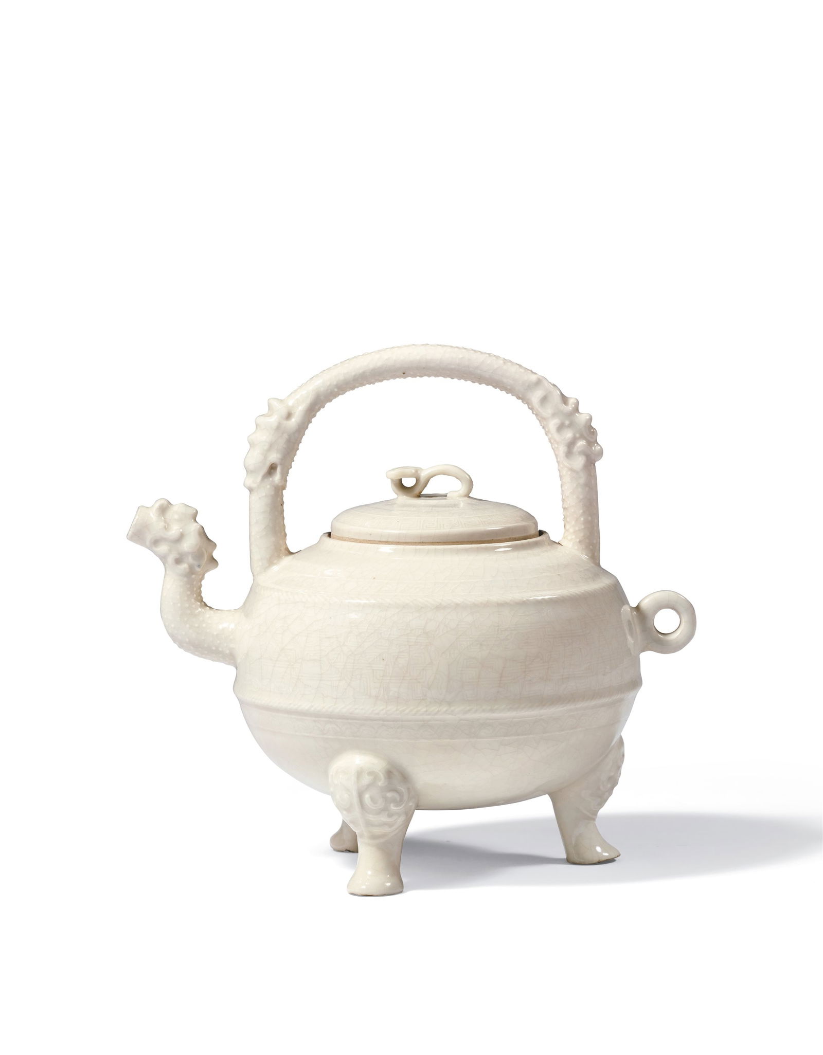 A DING-TYPE WHITE-GLAZED SWING-HANDLED EWER: Period of Qianlong, Qing Dynasty