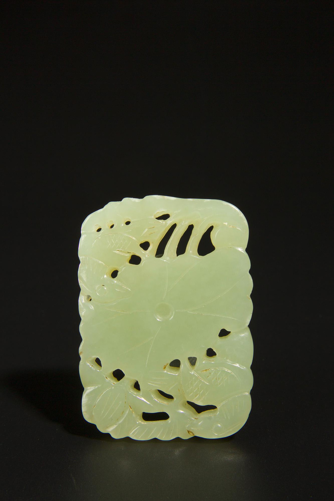 A greenish-white jade lotus leaf pendant (1 of 7)