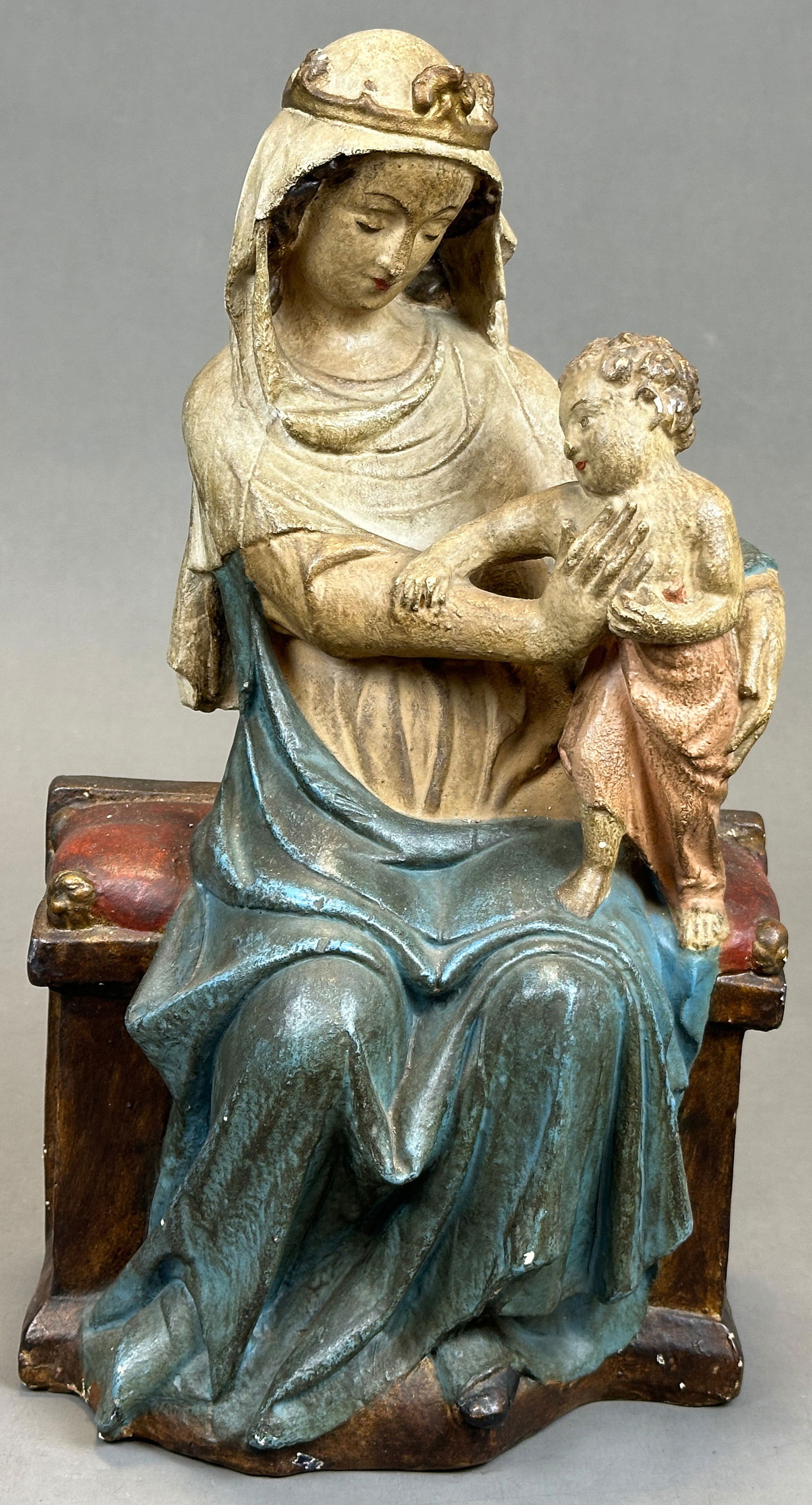 Figure of a saint. Mary with Christ Early 19th century. Austria.: Approx. 44.5 cm total height. Clay / plaster. Polychrome painted. Mother of God sitting with Christ child in her arms. Colour flaking. Heavily bumped. Traces of storage. See photos for condition. Cate