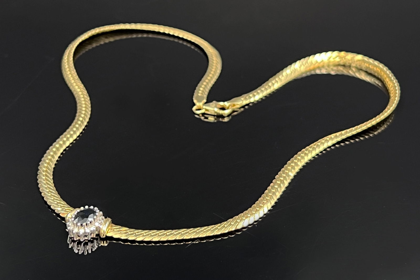 Necklace. 585 yellow gold and white gold with small diamonds and a sapphire. (1 of 6)