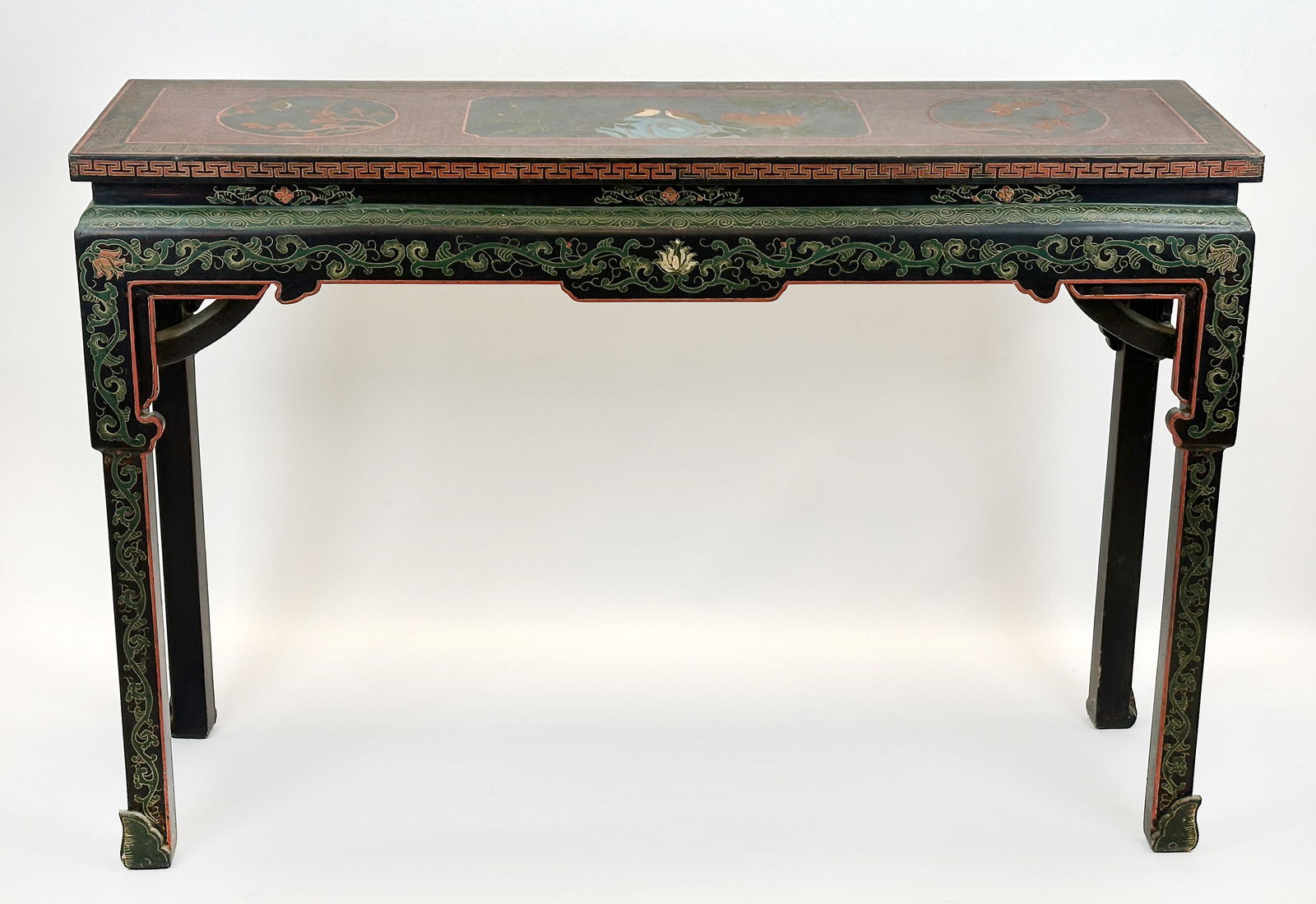 Holzkonsole. China. Anfang 20. Jahrhundert. Wooden console table. China. Early 20th century.: Approx. 87 cm x 127 cm x 36 cm. Wooden console table. Polychrome painted. Richly decorated with bird and plant motifs. Some areas of paint loss. Signs of wear due to age. Condition as shown in photos.