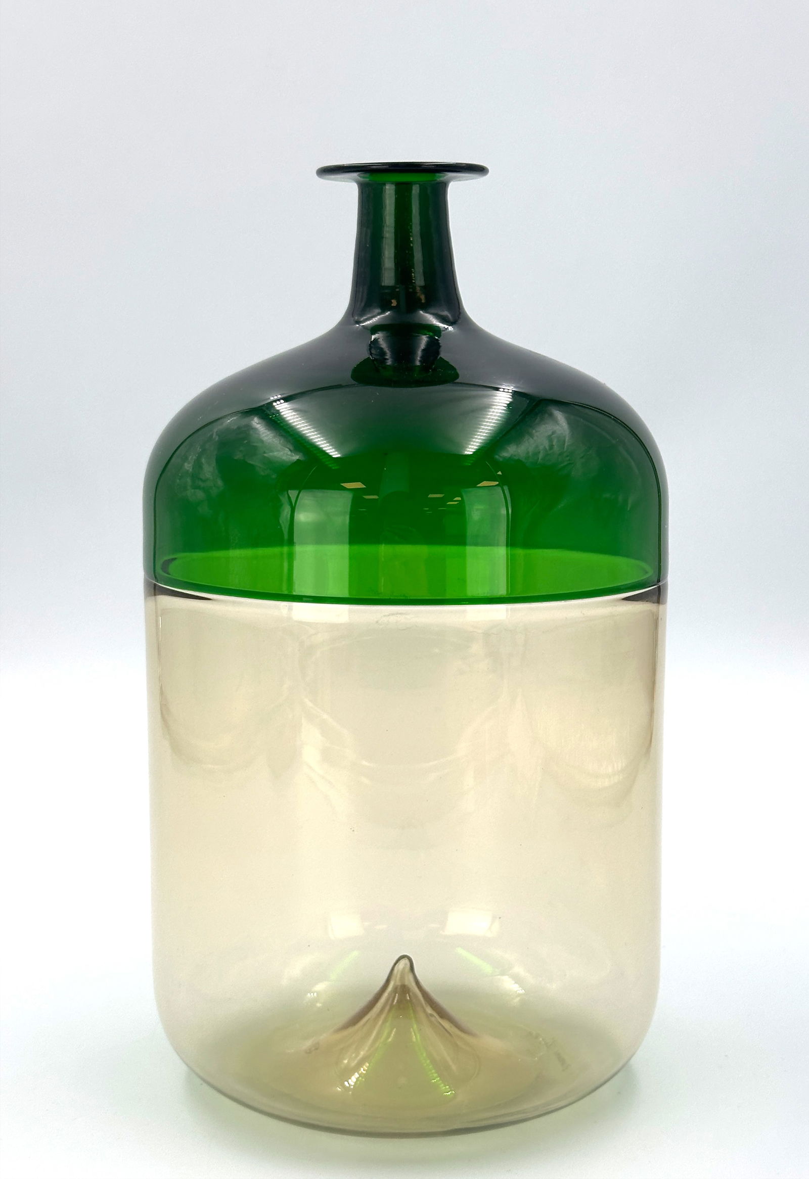 Tapio WIRKKALA (1915–1985). "Bolla." Venini Murano Glass Vase. 1966/68.: Approx. 24 cm x 13 cm in diameter. Cylindrical glass object. Green, amber and transparent. With a short neck and flat flared mouth. Made using the ‘incalmo’ technique. Glass masses fused t