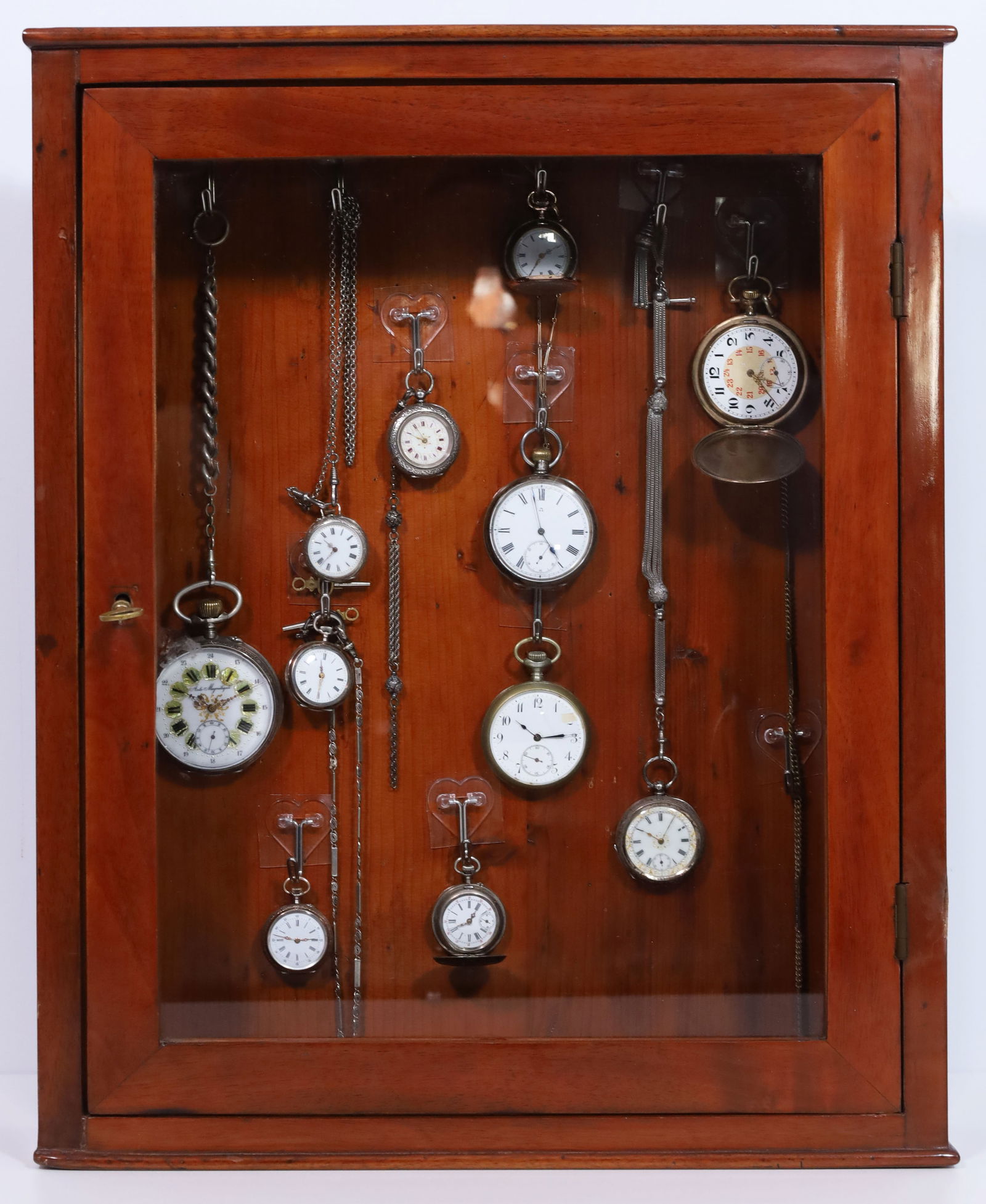 Biedermeier clock cabinet with 11 pocket watches. Silver and silver-plated.: Approx. 48 cm x 39 cm x 11 cm Biedermeier clock cabinet with glass door and key. Includes 11 pocket watches in various sizes, designs and from various manufacturers. Some are silver-plated, some are s