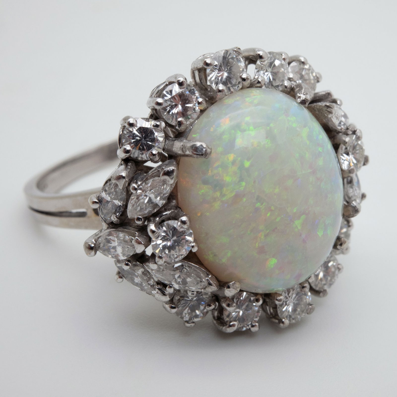 Entourage ring. 750 white gold with an opal cabochon and diamonds. (1 of 6)