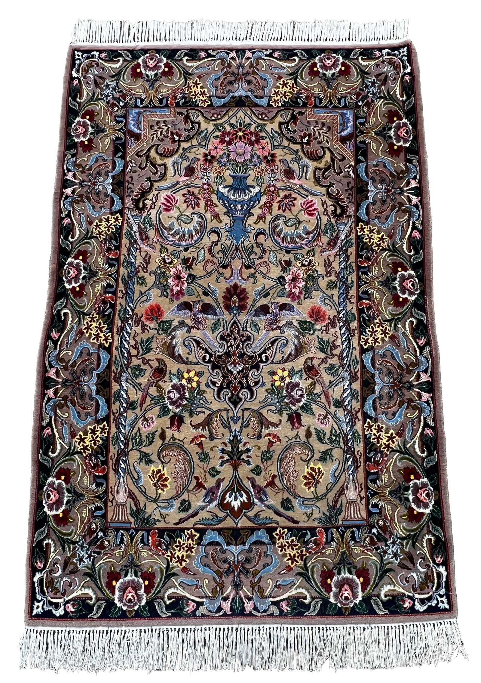 Isfahan. Approx.172 cm x 109 cm. Circa 1970.: Oriental carpet. Iran. Persian carpet. Hand-knotted. Cork wool on silk, decorated with silk. Master carpet. Fine knotting. Richly decorated with flowers and birds. Good condition considering its age.