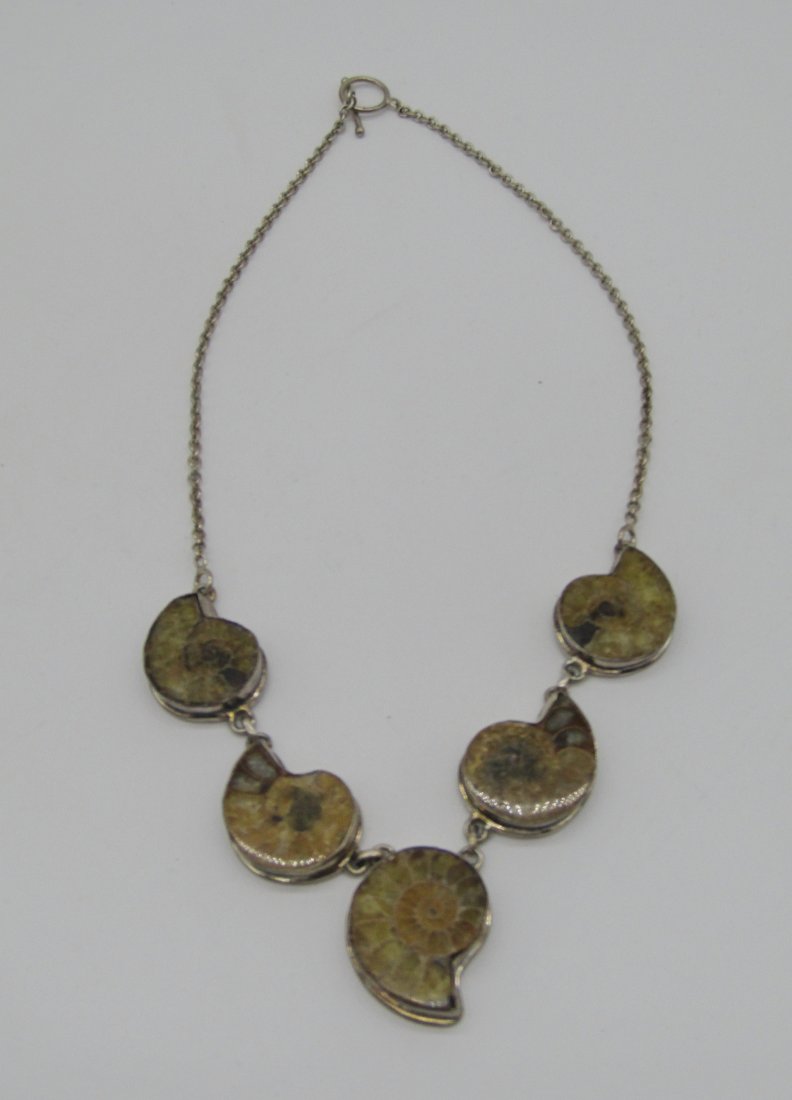 20" sterling and Ammonite necklace with toggle clasp: 20" sterling and ammonite necklace with toggle clasp. weighs 48 grams.