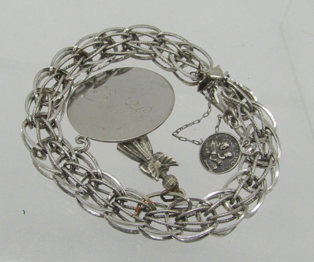 vintage heavy sterling charm bracelet with charms: nice sterling charm bracelet. weighs 37 grams.