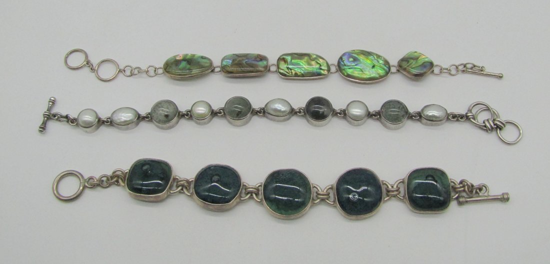 3 Fashion sterling bracelets with stones: nice sterling bracelet lot with abalone, pearls, glass, etc. toggle clasps. 97 grams tw.