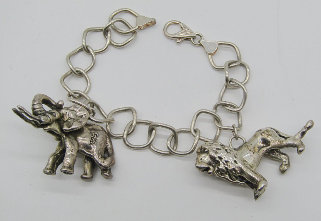 vintage Italian sterling charm bracelet with Lion & elephant charms: nice Italian sterling charm bracelet with large charms. weighs 27.5 grams.