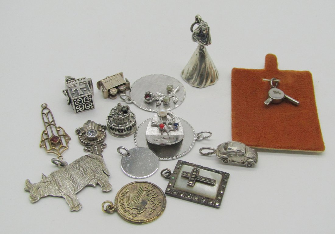estate lot of vintage sterling charms.: nice lot of vintage sterling charms.