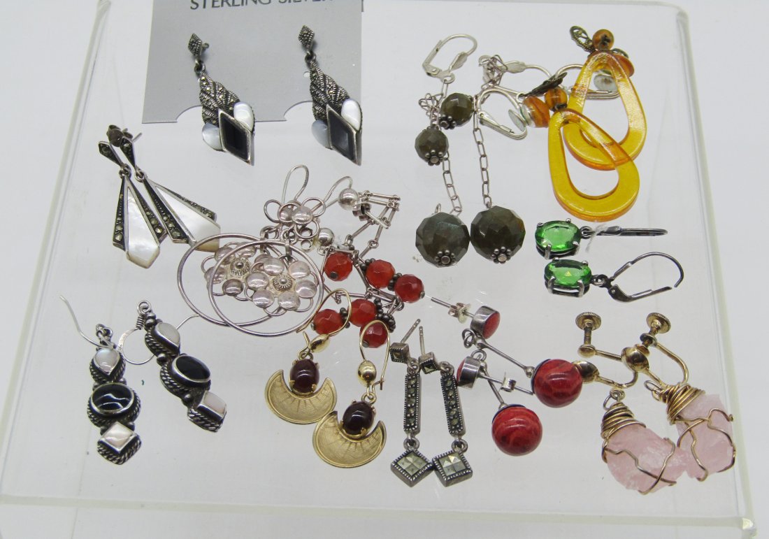 estate lot of 10 pair of vintage sterling earrings.: nice lot of vintage sterling earrings. lucite, stone, marcasite, etc. 68.5 grams tw.