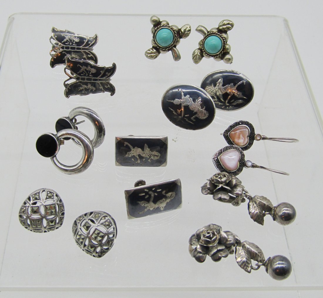 estate lot of 8 pair of vintage sterling earrings.: nice lot of vintage sterling earrings. turquoise, Siam, marcasite, etc. 46.5 grams tw.