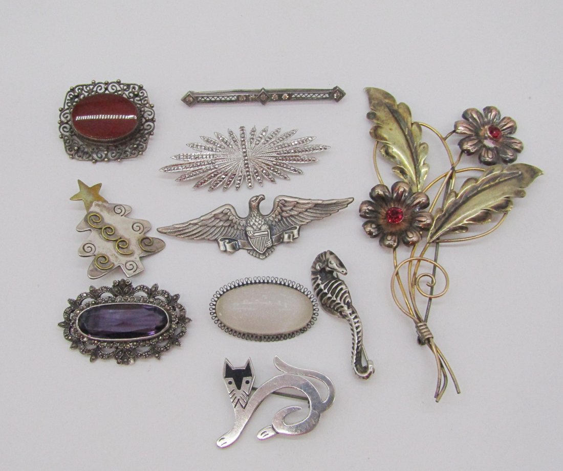 estate lot of 10 sterling pin/brooches: nice estate lot of vintage sterling pins/brooches to include Van Dell GF over sterling brooch, Taxco cat, seahorse, marcasite and amethyst, quartz, etc. 99 grams TW.