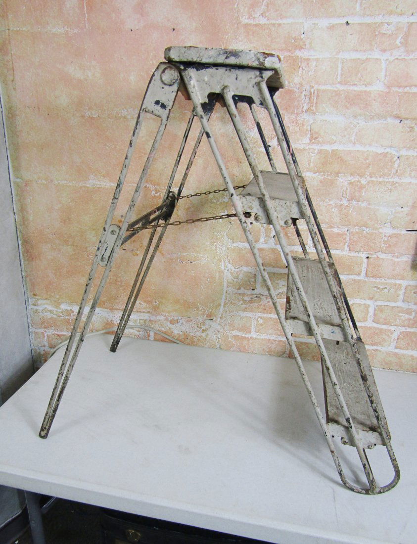 vintage wood step ladder with iron supports. (1 of 3)