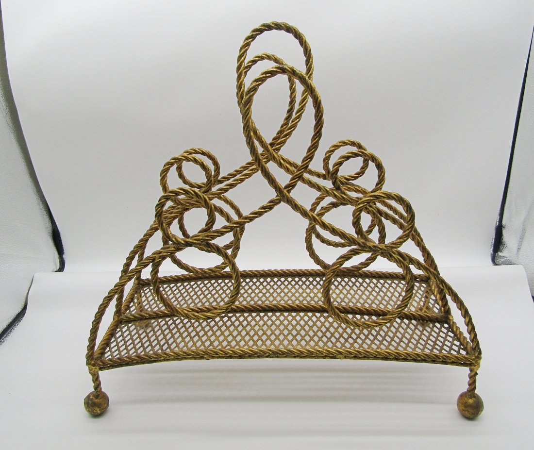 MCM, Hollywood Regency gold painted magazine rack, twisted Rope design: nice Italian MCM magazine rack. measures 16" high by 17" long. twisted rope design, tassel shape feet.