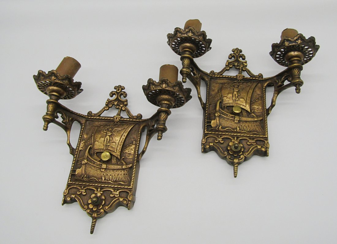 pair of Art Deco, Gothic style wall sconces with Viking ship: nice pair of 2 arm Gothic style, Art Deco period wall sconces. brass, brass finished. shows Viking long boat with winged Female on sail. measures 9 x 9".
