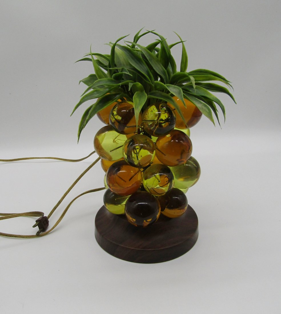 MCM fruit lamp with Lucite balls, berries: Mid Century Lamp in the form of pineapple? fruit. stands 11" high. lamp has large amber and citrine color Lucite balls, berries. faux leaves, top section. metal base with faux wood grain. has a small 
