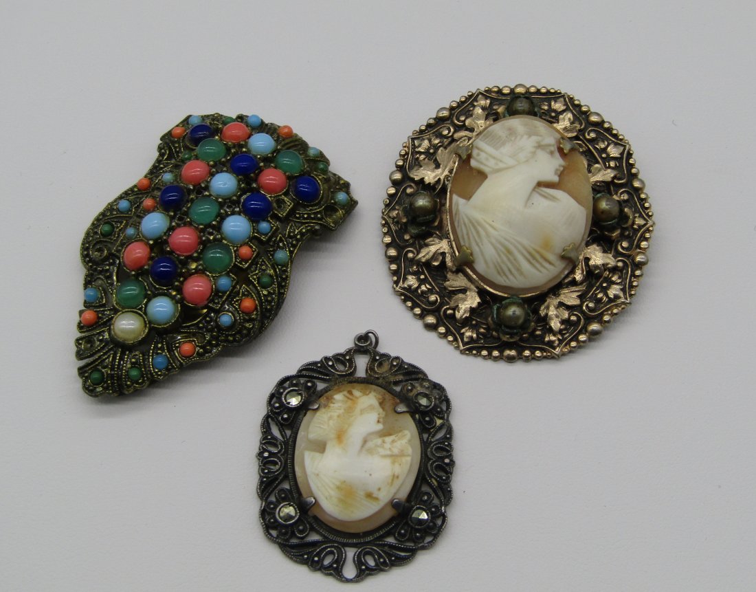 antique cameos and Deco clip: included, carved shell cameo brooch in gold plate frame, shell cameo pendant in sterling frame, Art Deco clip with colorful Czech stones.