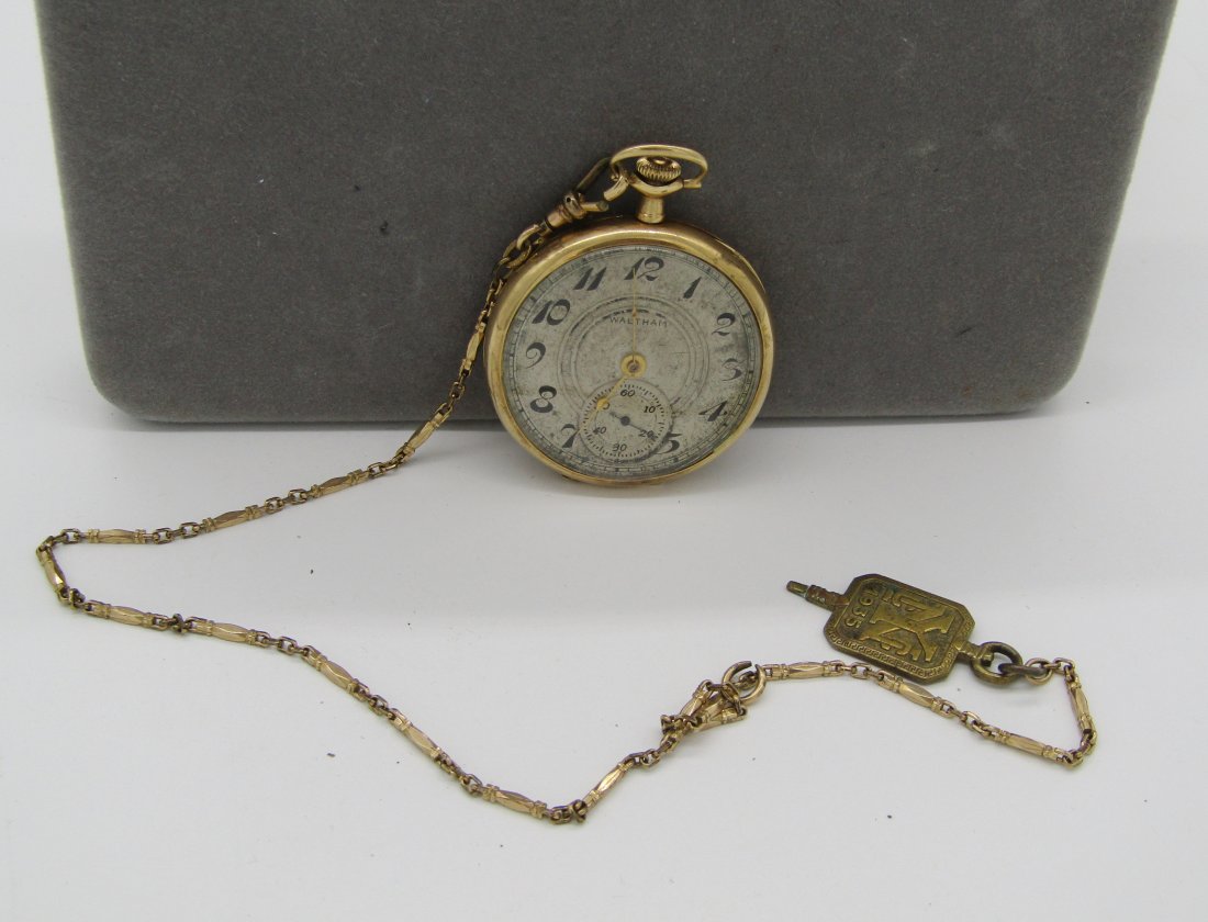 Antique 12S Waltham open face pocket watch in 14K gold case: Waltham 12S open face pocket watch in 14K gold case. swing out movement. comes with gold filled PW chain and school fob.