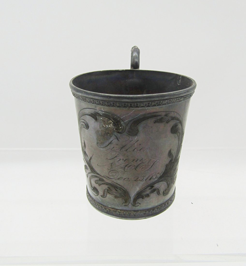 Antique, 1855 Coin silver cup: dated 1855 Coin silver cup. inscribed and dated. marked underneath Pure Silver Coin, hallmarks T&W flanked by birds. measures 3" to top of handle.
