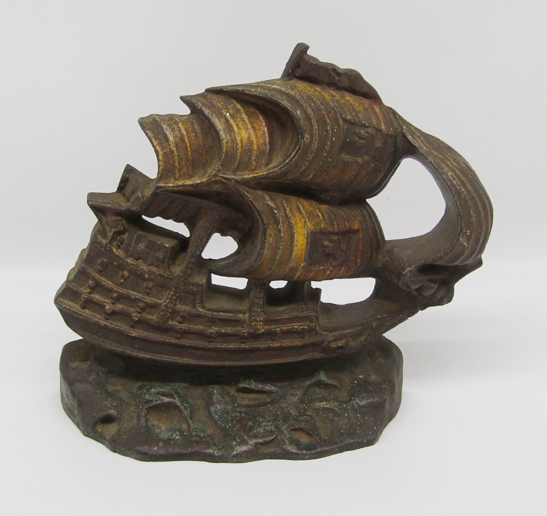 antique cast iron doorstop door stop of Galleon, multi Sail Ship: antique cast iron doorstop of Galleon. measures 8 x 9". very good condition. wear to paint. no chips, cracks.