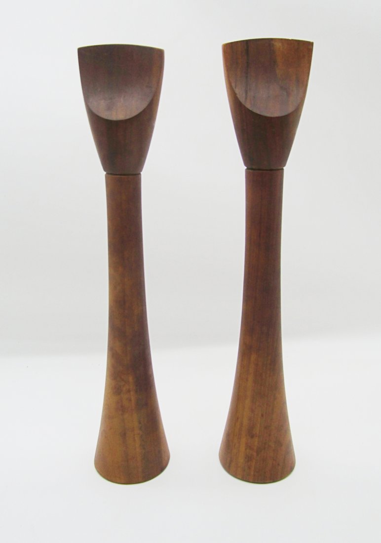Rare Dansk teak Wood Salt and and pepper set by Jens Quistgaard: vintage JHQ teakwood salt and pepper set by Dansk. each measure 14+1/2" tall. the pepper grind turns fine and works. the salt shaker head is loose and comes off. no chips or heavy wear.