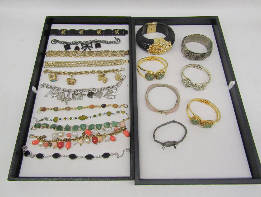2 trays of vintage costume and Fashion bracelets: nice selection of bracelets to include hinged. clamper, charm. tennis, scarab, rose quartz, damascene, stone, military, etc.