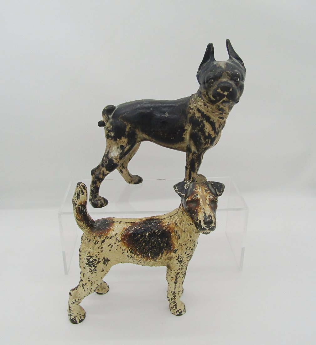 2 Antique Cast Iron Terrier Dog Doorstops, door stops by Hubley: 2 original Iron doorstops by Hubley. Boston Terrier stands over 9" tall. no breaks or chips. has paint loss. Fox Terrier stands just under 9". no chips or cracks. minor paint loss.
