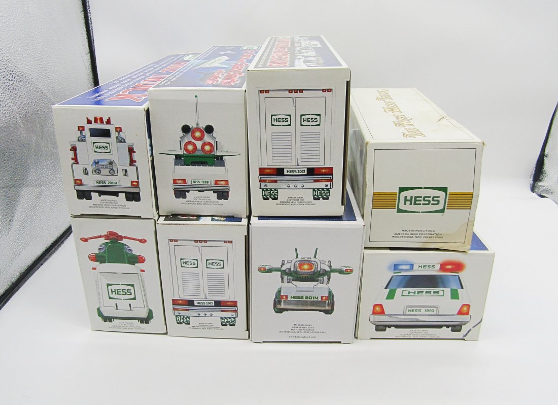 lot of Hess gas station toys in boxes: nice lot of vintage Hess trucks and toys. all but 1980 oil tanker, mint in boxes, not played with.