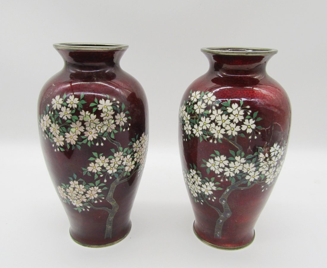 pair of Japanese enamel and cloisonne vases by Yamamoto: pair of 6+1/2" Mid Century enamel and cloisonne vases by Yamamoto. each with cherry blossom trees on a red back round.